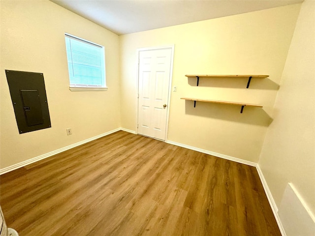 520 Lakeside Dr, Rockwall, TX 75032 - unfurnished room featuring baseboards, wood finished floors, and electric panel
