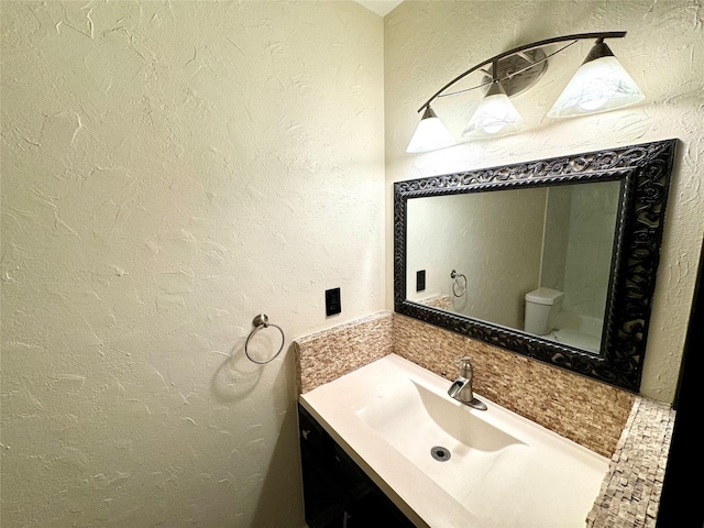 520 Lakeside Dr, Rockwall, TX 75032 - bathroom with vanity, a textured wall, and toilet