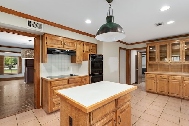 kitchen with backsplash, visible vents, crown molding, black appliances, and under cabinet range hood