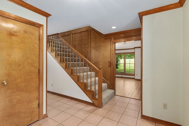 stairway with recessed lighting, baseboards, and tile patterned floors