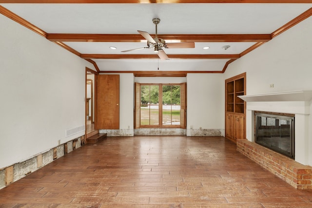 unfurnished living room with beam ceiling, a fireplace, a ceiling fan, visible vents, and hardwood / wood-style flooring