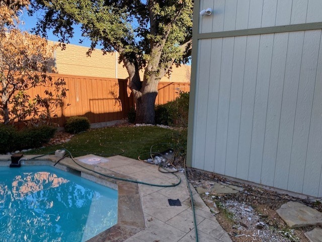 view of swimming pool with a fenced in pool and a fenced backyard