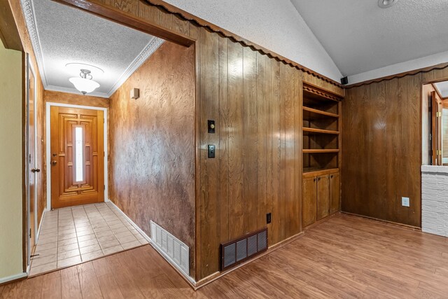 full bathroom featuring toilet, a shower with door, tile patterned flooring, and vanity