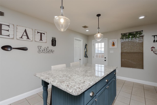 kitchen with blue cabinetry, light tile patterned floors, hanging light fixtures, baseboards, and recessed lighting