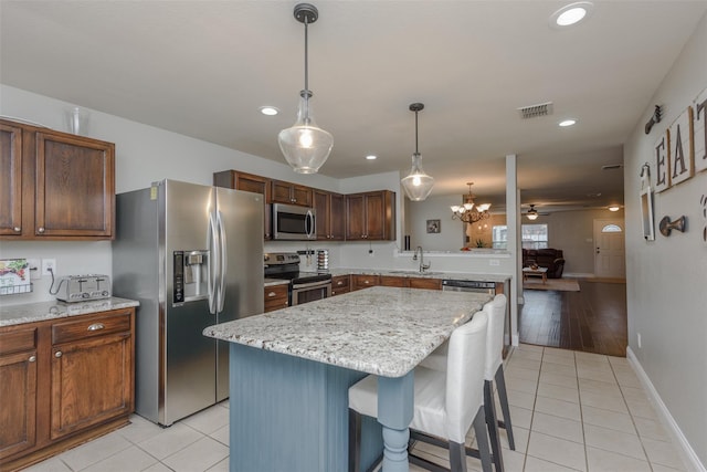 kitchen with appliances with stainless steel finishes, visible vents, light tile patterned floors, and recessed lighting