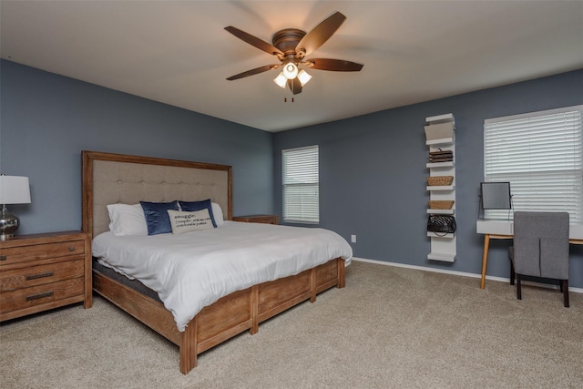 bedroom with carpet, baseboards, and a ceiling fan