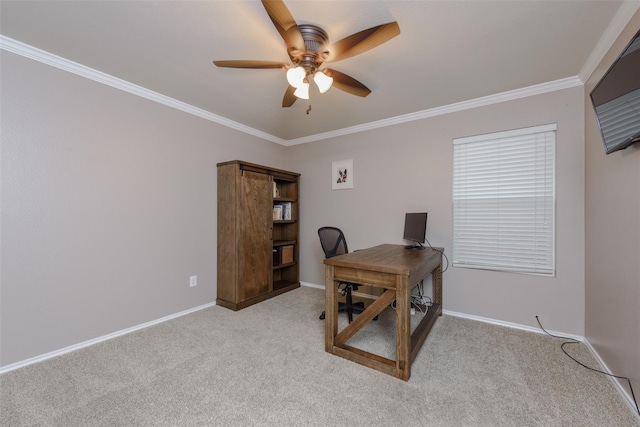 office space featuring a ceiling fan, light carpet, ornamental molding, and baseboards