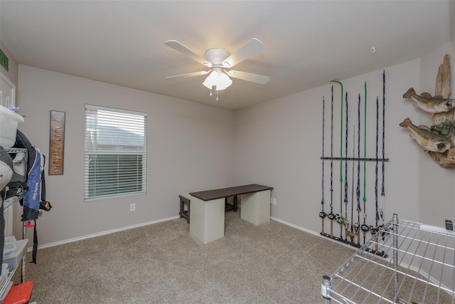 unfurnished office with baseboards, ceiling fan, and carpet floors