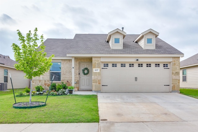 cape cod-style house with a front lawn, stone siding, central AC unit, concrete driveway, and an attached garage