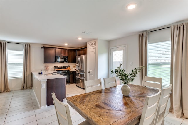 dining space with recessed lighting, baseboards, visible vents, and light tile patterned floors
