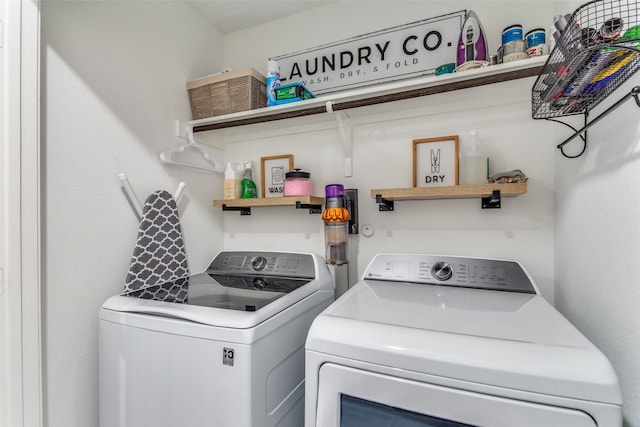 laundry area with laundry area and washer and clothes dryer
