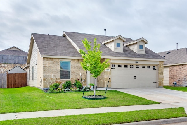cape cod home featuring a garage, a front lawn, fence, brick siding, and driveway