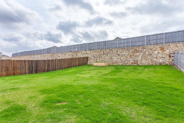 view of yard with a fenced backyard