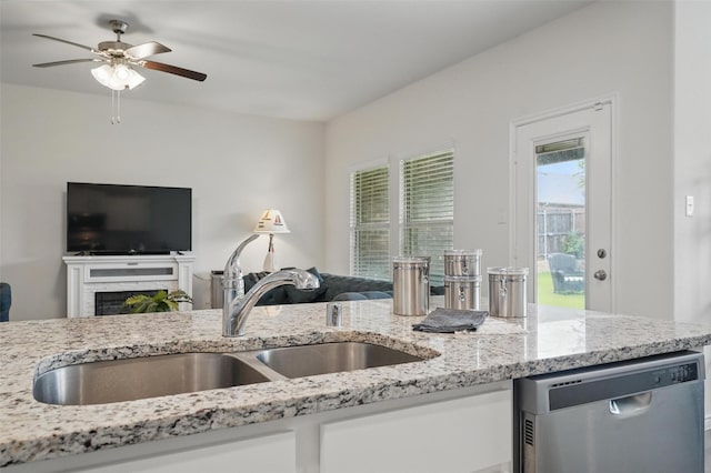 901 Cherry Blossom St, Anna, TX 75409 - kitchen featuring a sink, light stone counters, stainless steel dishwasher, and open floor plan