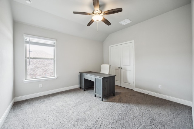 unfurnished office with a ceiling fan, carpet flooring, lofted ceiling, and visible vents