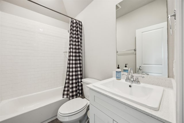 bathroom featuring vanity, shower / tub combo, and toilet