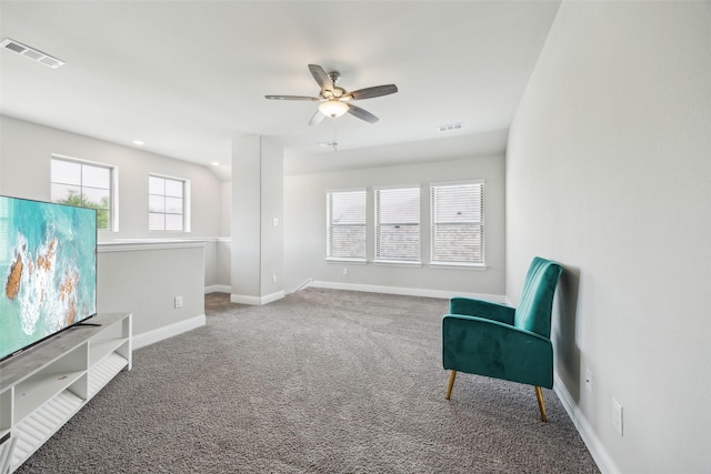 unfurnished room featuring carpet floors, ceiling fan, baseboards, and visible vents