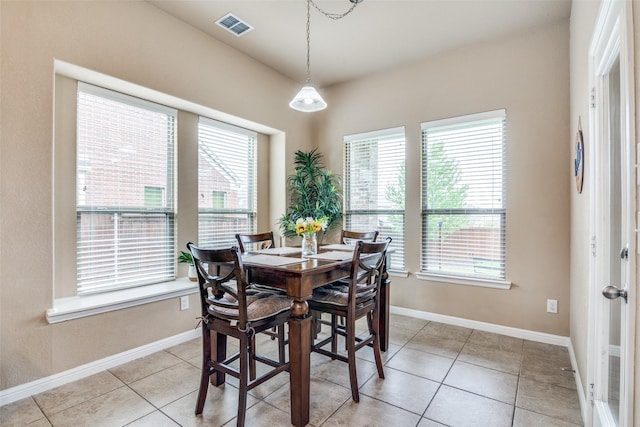 dining area with visible vents, baseboards, and light tile patterned flooring
