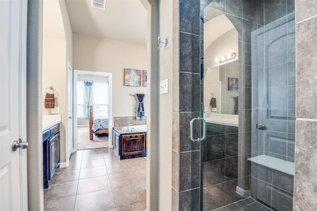 bathroom featuring visible vents, vanity, ensuite bathroom, tile patterned floors, and a stall shower