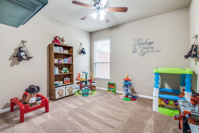 game room featuring carpet flooring, ceiling fan, and baseboards