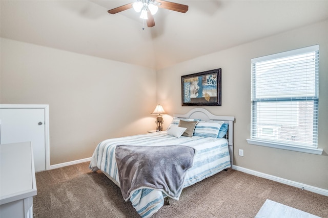 bedroom featuring baseboards, carpet, and multiple windows