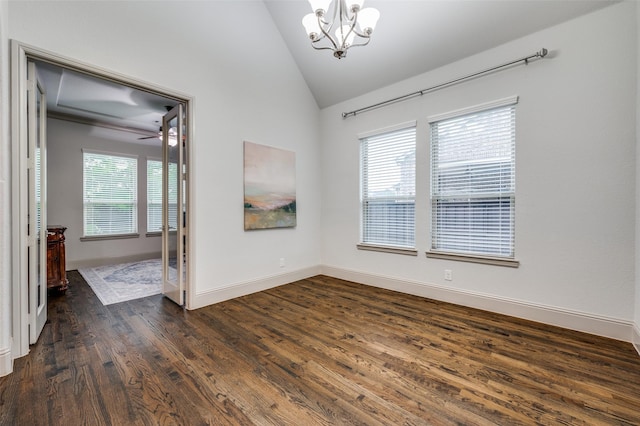 unfurnished room featuring dark wood-style flooring, baseboards, an inviting chandelier, and lofted ceiling