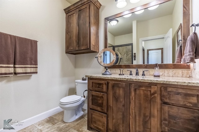 full bathroom with a shower with shower door, vanity, toilet, tile patterned floors, and baseboards