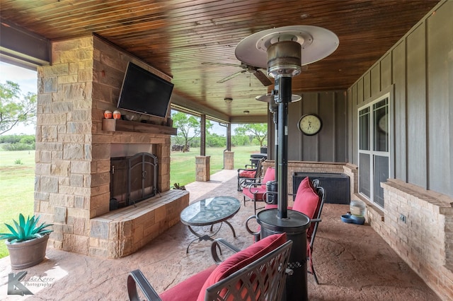 view of patio with an outdoor stone fireplace