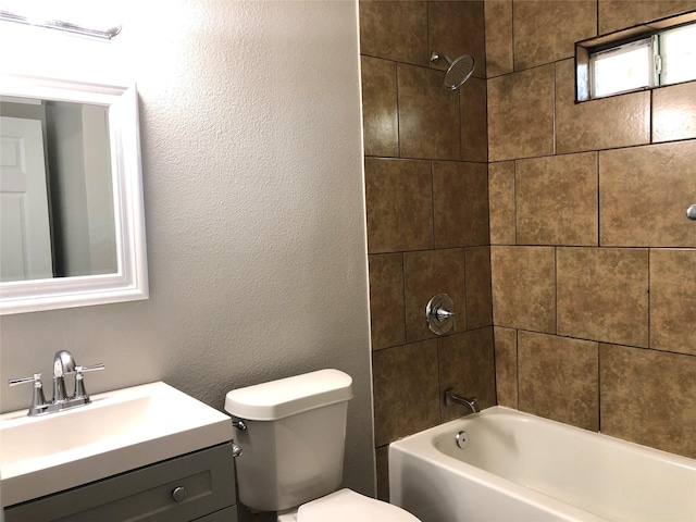 bathroom with toilet, bathing tub / shower combination, and vanity