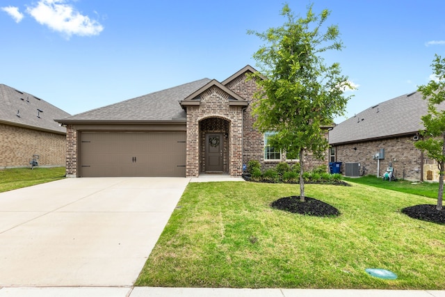 view of front of home featuring concrete driveway, brick siding, an attached garage, and central air condition unit