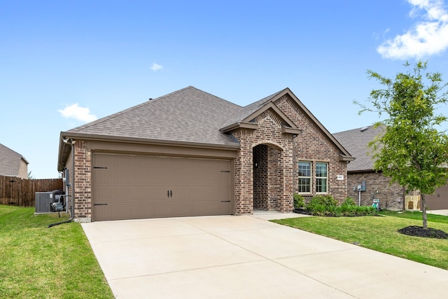 604 Stampede Ln, Princeton, TX 75407 - view of front of property with brick siding, a shingled roof, a garage, and concrete driveway