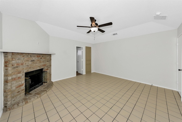 unfurnished living room featuring a brick fireplace, ceiling fan, visible vents, and baseboards