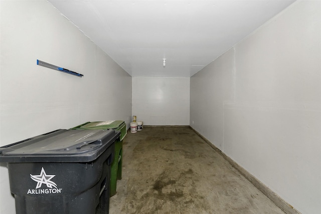 interior space featuring unfinished concrete flooring