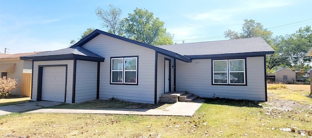 single story home with a garage, a front lawn, roof with shingles, and driveway