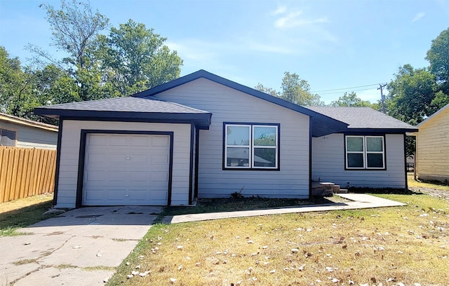 single story home with a garage, fence, a front yard, roof with shingles, and concrete driveway