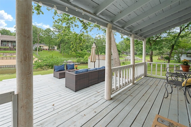 wooden terrace with outdoor lounge area