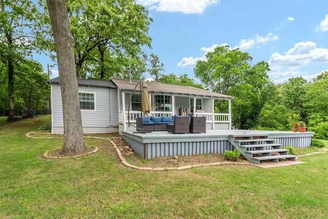 rear view of property with outdoor lounge area, a yard, and a deck