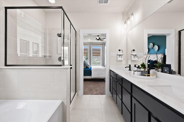 bathroom featuring double vanity, ensuite bathroom, a bath, a ceiling fan, and a stall shower