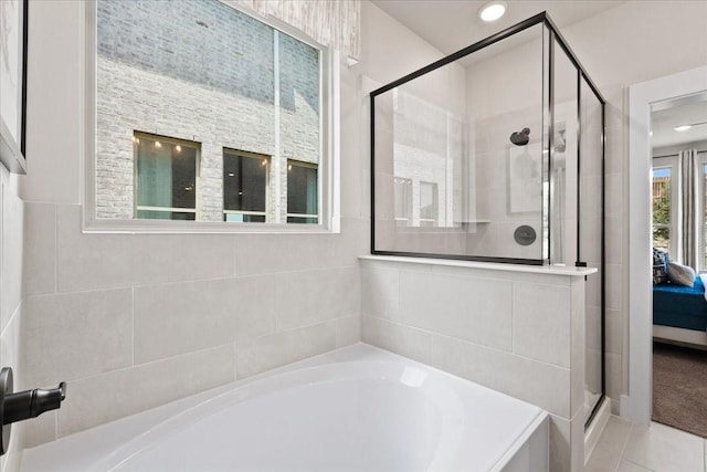 ensuite bathroom with ensuite bathroom, a shower stall, recessed lighting, and a bath