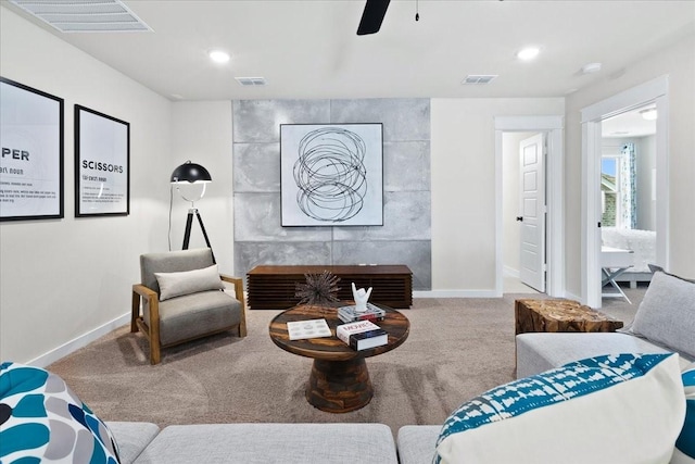 living area with carpet floors and visible vents