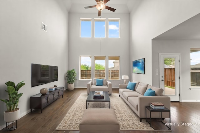 1617 Beauregard Point Dr, Wylie, TX 75098 - living room with visible vents, dark wood finished floors, a towering ceiling, and ceiling fan