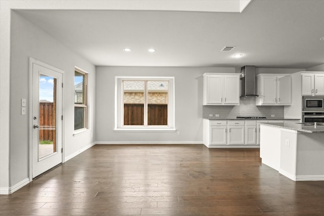 1617 Beauregard Point Dr, Wylie, TX 75098 - kitchen featuring visible vents, appliances with stainless steel finishes, a healthy amount of sunlight, and wall chimney range hood