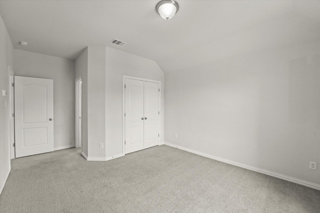 1617 Beauregard Point Dr, Wylie, TX 75098 - unfurnished bedroom with carpet, baseboards, lofted ceiling, visible vents, and a closet