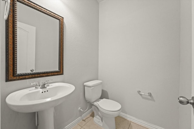 1617 Beauregard Point Dr, Wylie, TX 75098 - half bath featuring toilet, baseboards, and tile patterned flooring