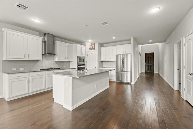 1617 Beauregard Point Dr, Wylie, TX 75098 - kitchen with visible vents, wall chimney exhaust hood, white cabinets, and stainless steel appliances