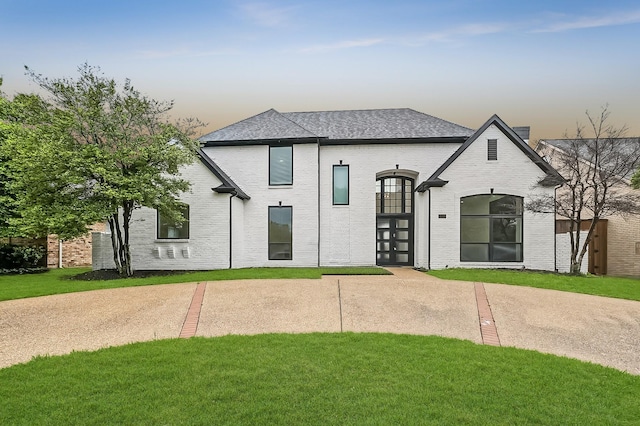 4219 Hollow Oak Dr, Dallas, TX 75287 - rear view of house with a yard and brick siding