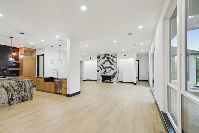 4219 Hollow Oak Dr, Dallas, TX 75287 - kitchen featuring light wood finished floors, recessed lighting, open floor plan, stainless steel dishwasher, and modern cabinets