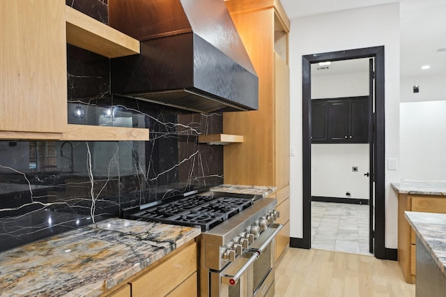 4219 Hollow Oak Dr, Dallas, TX 75287 - kitchen featuring wall chimney range hood, range with two ovens, tasteful backsplash, open shelves, and light stone counters