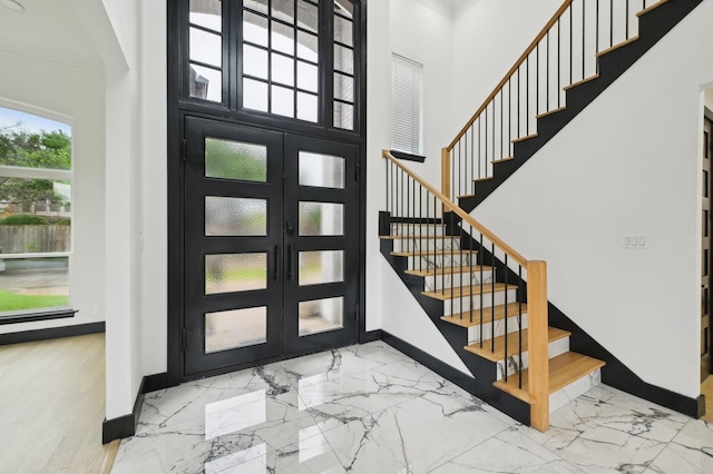 4219 Hollow Oak Dr, Dallas, TX 75287 - entryway with crown molding, baseboards, stairs, and marble finish floor