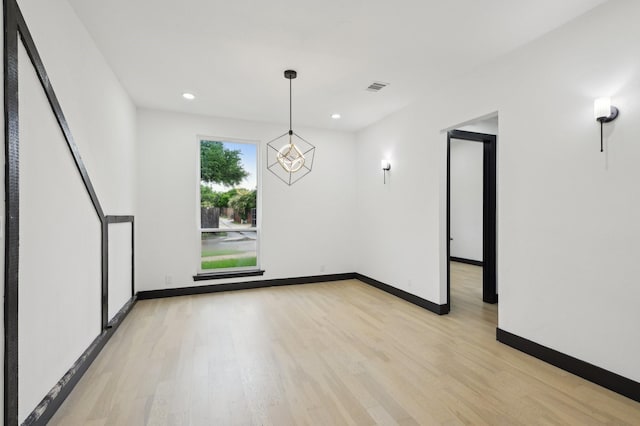 4219 Hollow Oak Dr, Dallas, TX 75287 - interior space with baseboards, visible vents, an inviting chandelier, and light wood-style floors